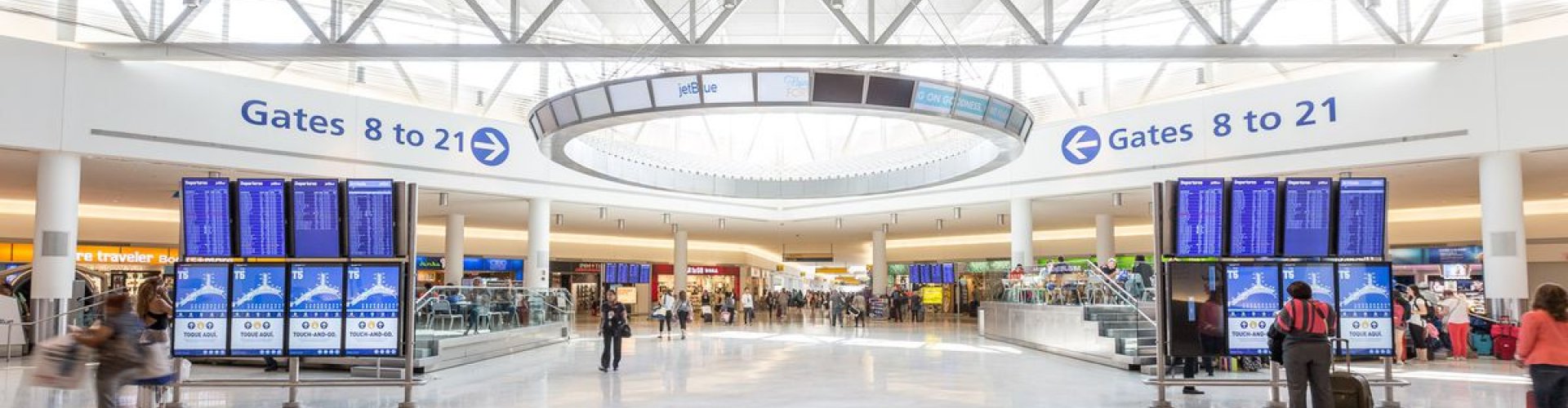 Crowded lounge interior at John F. Kennedy International Airport, NY, US